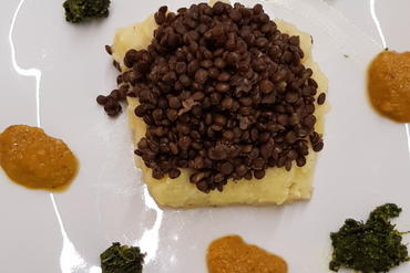 black lentils on potato mash